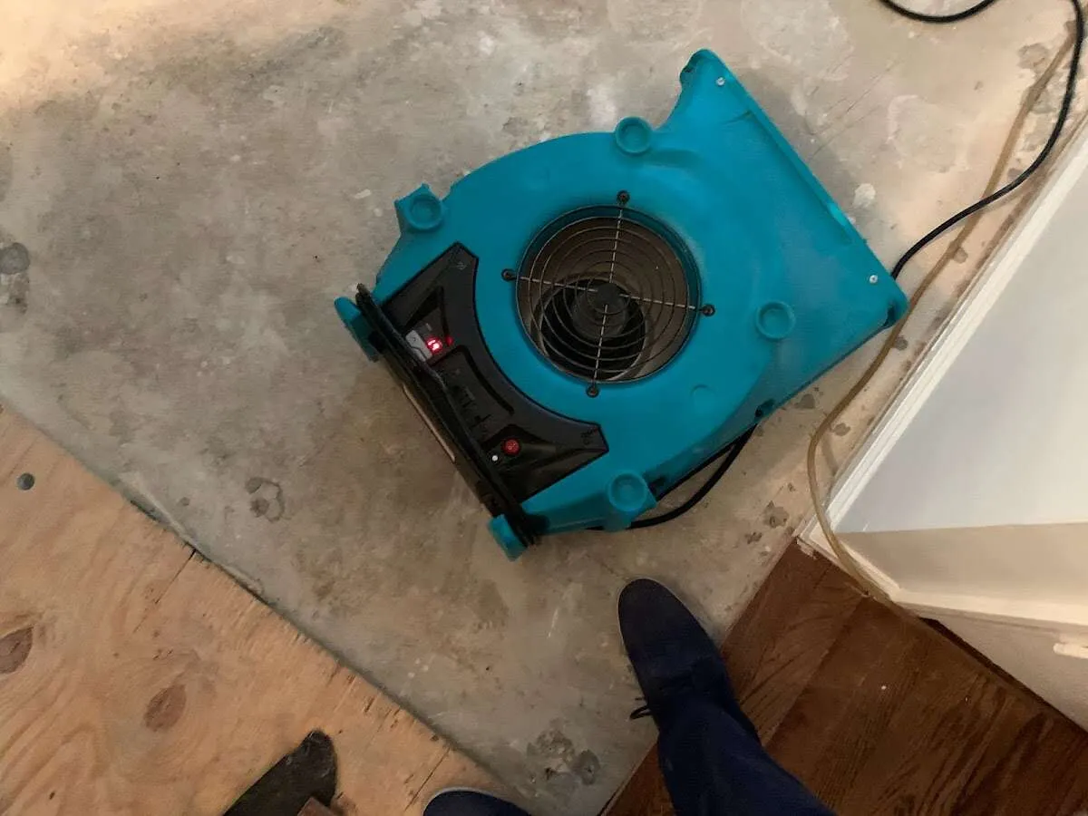 Air mover drying subfloor during Leak Detection & Repair in Lake City